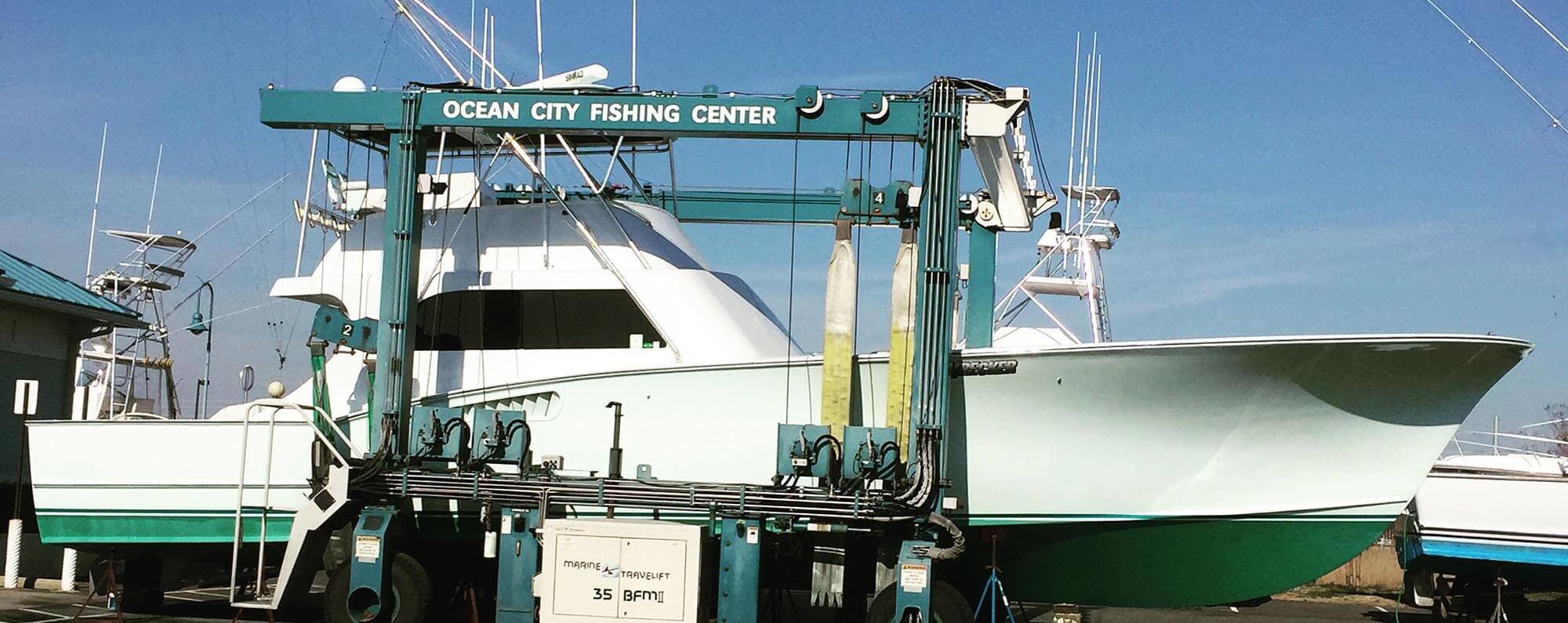 Ocean City Fishing Center travel lift carrying a boat